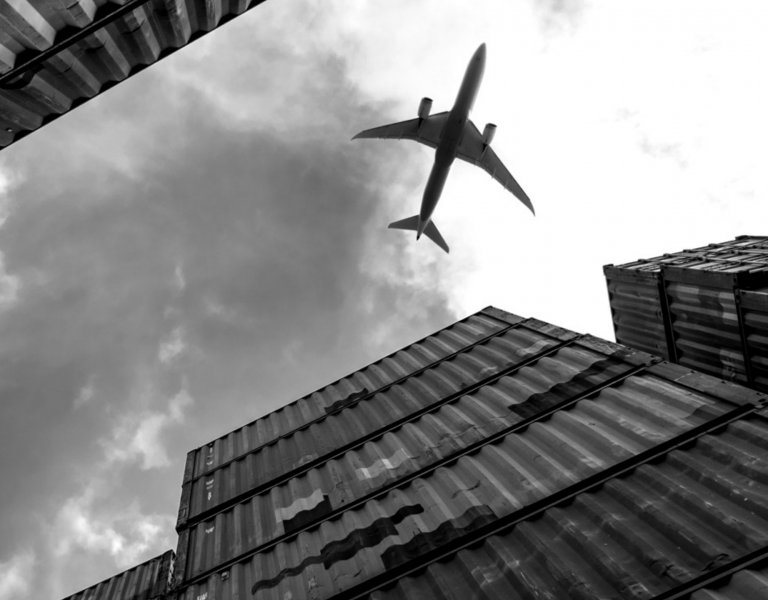 Airplane against cloudy sky